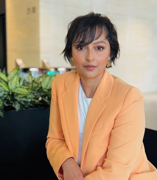 Avani Parikh sitting at her desk