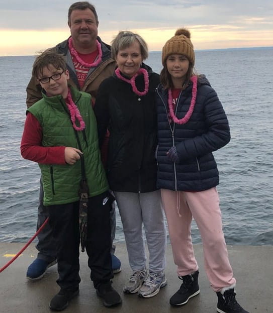 Konstance standing with her family on a pier, 2020 Run for the Cure (virtual).