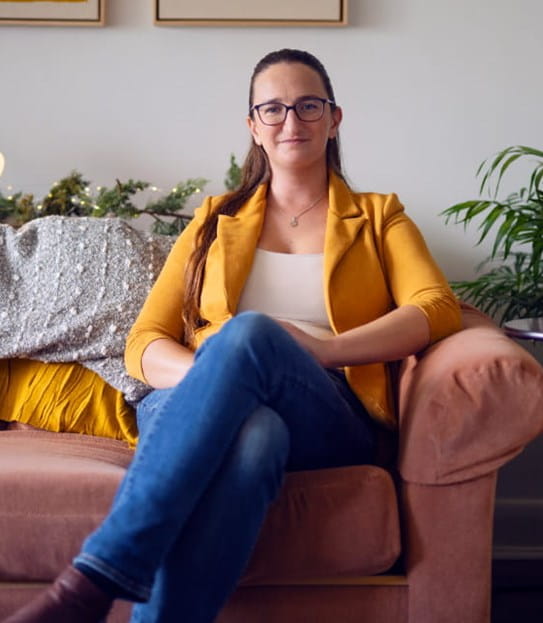 Marie-Noëlle Séguin Grignon sitting on a couch