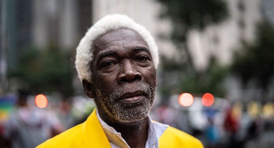 An older Black man looking at the camera.