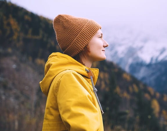 Woman looks out over landscape